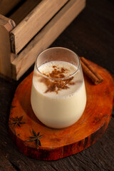 Eggnog cup with cinnamon powder.