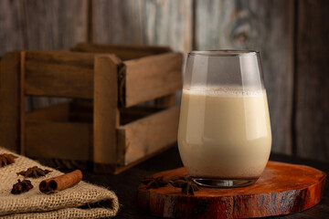 Eggnog cup with cinnamon powder.