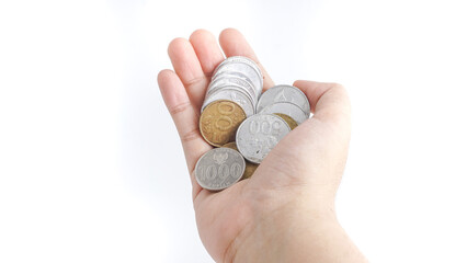 Close up Indonesian Coins in hands. Selective Focus