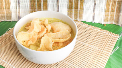 Indonesian favorite food made from chicken broth contains bean sprout, vermicelli, chicken and is served with chili. selective focus