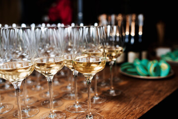 Champagne glasses on gold background. Party and holiday celebration concept