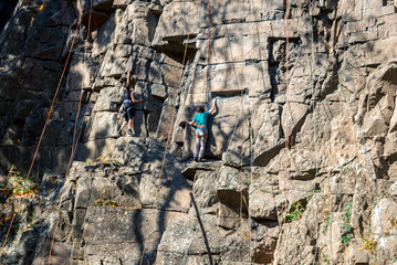 girls climbers on ropes climb up