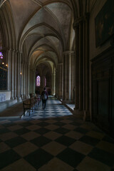 Obraz premium Woman wallking inside the men's abbey l'Abbaye-aux-Hommes, Caen, Normandy, France