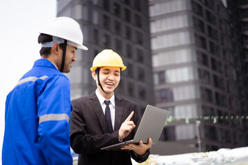 Professional Asian foreman and construction manager talking - discussing about building structure plant.