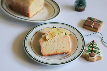 Homemade Lemon cake decorated with cookie for party. Tasty dessert for winter holidays. Merry Christmas and Happy New Year atmosphere.