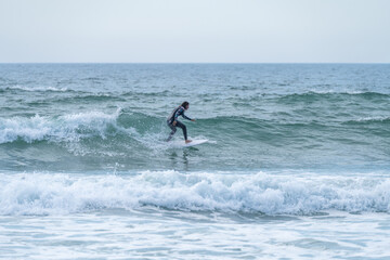 Surfer girl riding a wave