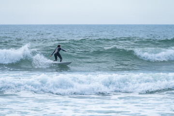 Surfer girl riding a wave