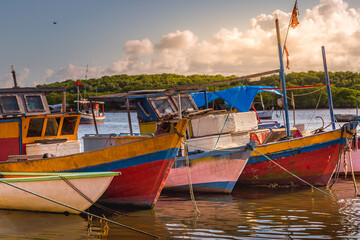 Fototapeta na wymiar Bay at sunset with fishing trawler rustic boats in Porto Seguro, BAHIA, Brazil
