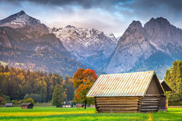 Fototapeta na wymiar Bavarian alps autumn and wooden barn at sunset, Garmisch Partenkirchen, Germany