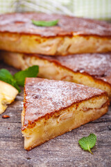 Pie with apple and pear on wooden rustic table. Close up
