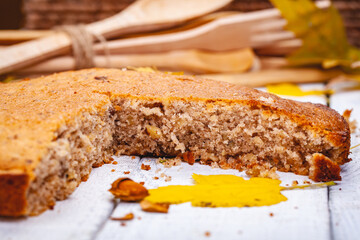 Semolina cake or manna pie with walnuts and raisins on wooden rustic table. Close up