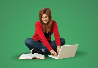 Young girl student sitting on floor with laptop computer