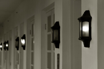 row of vintage lamps light on wall