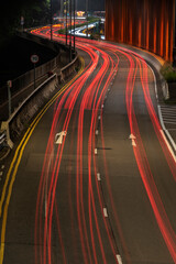Fototapeta na wymiar Light trails of traffic on road at night. Transportation background