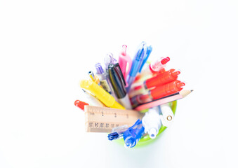 Close up red pen in a green basket.