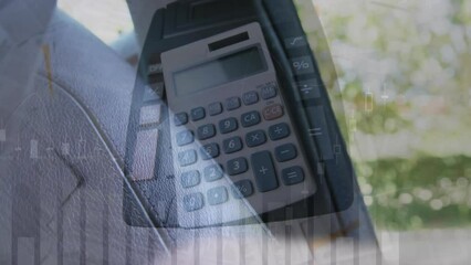 Animation of calculators over cropped hand of caucasian man buckling car seatbelt - Powered by Adobe