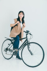 Obraz na płótnie Canvas 自転車に乗る女性　bicycle