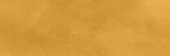Gold or yellow paint on cement wall texture or background. Bright orange wall