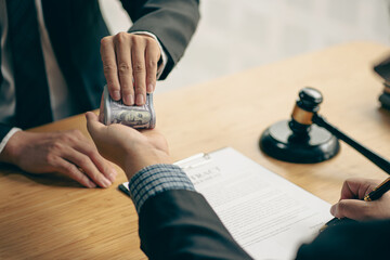 An attorney or officer accepts bribes from clients in the courtroom. Taking bribes to gain an...