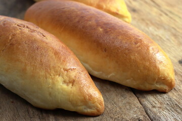 Healthy homemade fish bun on old wooden table. Home made bun