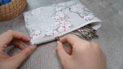 Simple zipper pouch made out of cotton fabric with gray color