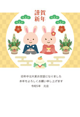2023年の年賀状　正座する2匹のウサギ 金背景