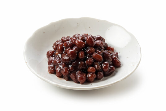 Boiled azuki beans placed on a white background.