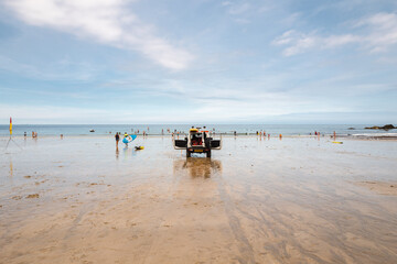 Lifeguards on the beach in Cornwall. 