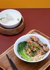 Mie ayam ceker (Chicken noodle with tasty chicken feet), Indonesian street food consist of noodle, vegetables, chicken meat and chicken feet. Popular food in the country