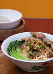 Mie ayam ceker (Chicken noodle with tasty chicken feet), Indonesian street food consist of noodle, vegetables, chicken meat and chicken feet. Popular food in the country