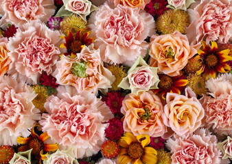 Beautiful wedding flower background. Arrangement of gazania, roses and carnations