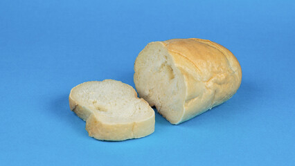 A sliced loaf of white bread on a blue background.