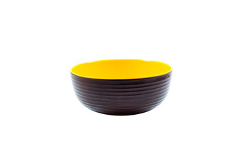 empty brown plastic bowl with yellow inside isolated on white