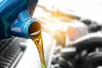 Refueling and pouring oil quality on background the engine motor car Transmission and Maintenance...