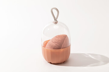 Makeup sponge, facial accessory, on a white background, close-up