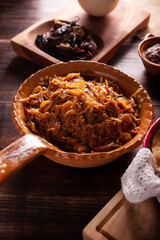 Tinga de Res. Typical Mexican dish prepared mainly with shredded beef, onion and dried chilies. It is customary to serve it on corn tortilla tostadas or tacos.