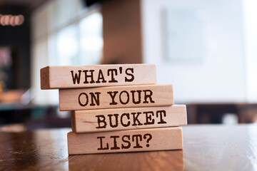 Wooden blocks with words 'What's On Your Bucket List?'. Business concept