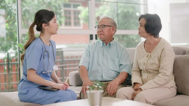 Elderly people healthcare tech and prescription online concept.asian senior people listening to young nurse or doctor explaining therapy treatment effect and how to take pills in a nursing home.