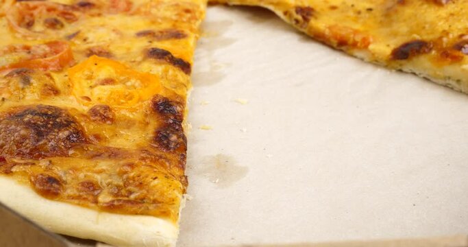 a slice of cheese margherita pizza close up. High quality 4k footage
