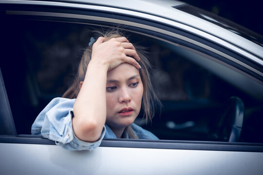 woman driver shock sad unconcious from accident. lady drive with head ache boring from tax cost of car concept.