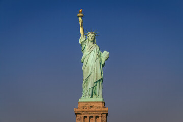Fototapeta premium Statue of Liberty and clear sky at sunset, New York City, United States
