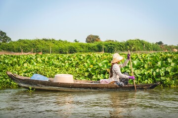 Local trader in rowing boat, floating village, boat trip, Tonle Sap Lake, Cambodia, Southeast Asia, Asia