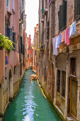 Narrow canal in Venice at summer time