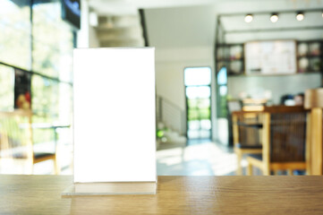 Wenu frame standing on wood table in  Bar restaurant cafe. Space for text marketing promotion. 