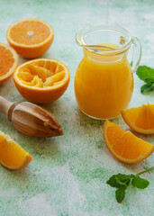 Glass jug of fresh orange juice