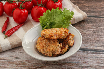 Fried salmonn cutlet in the bowl