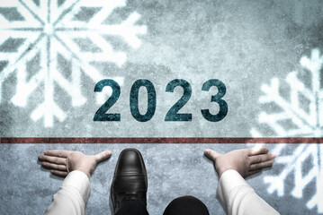 2023 Year Concept. Businessman on way road leading forward to happy new year celebration in...
