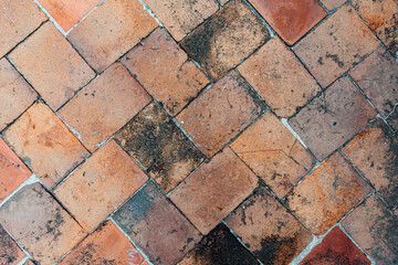 Chinese traditional vermilion rectangular floor tiles laid in a woven way