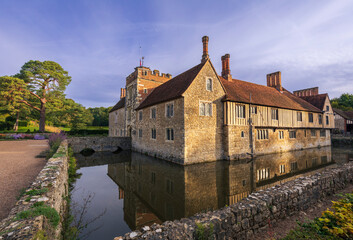 Early morning autumn light on the medieval ightham mote manor house in the Kent countryside south...