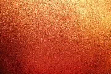 Sparkle glowing dark orange shade glitter of carborundum abstract textured background, can use for celebrate christmas day, new year day or birthday